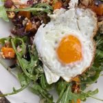 Plant-forward, paleo breakfast salad of roasted vegetables and rocket.