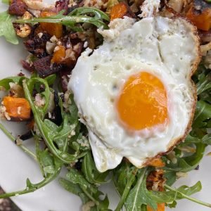 Plant-forward, paleo breakfast salad of roasted vegetables and rocket.