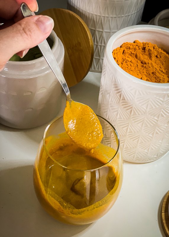 Golden Milk recipe showed as a paste in a glass